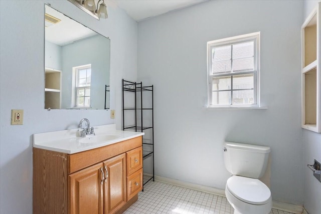 413 Houghton Ave, Marlin, TX 76661 - bathroom with toilet, vanity, tile patterned flooring, and baseboards
