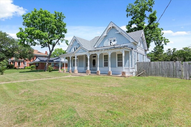 413 Houghton Ave, Marlin, TX 76661 - victorian house featuring a porch and a shingled roof
