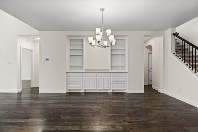1514 Carnation St, Celina, TX 75078 - unfurnished dining area with stairway, a chandelier, dark wood-style floors, baseboards, and built in shelves
