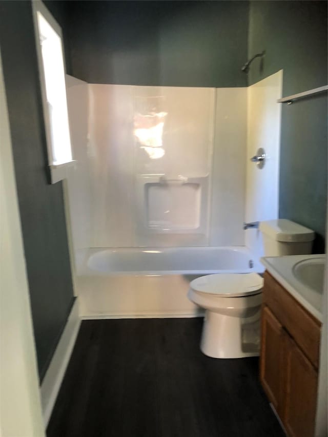 4122 Carver St, Shreveport, LA 71109 - bathroom featuring toilet, vanity, shower / tub combination, and wood finished floors
