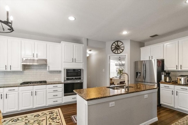 406 Doyle Dr, Keller, TX 76248 - kitchen featuring stainless steel appliances, a sink, under cabinet range hood, white cabinets, and recessed lighting