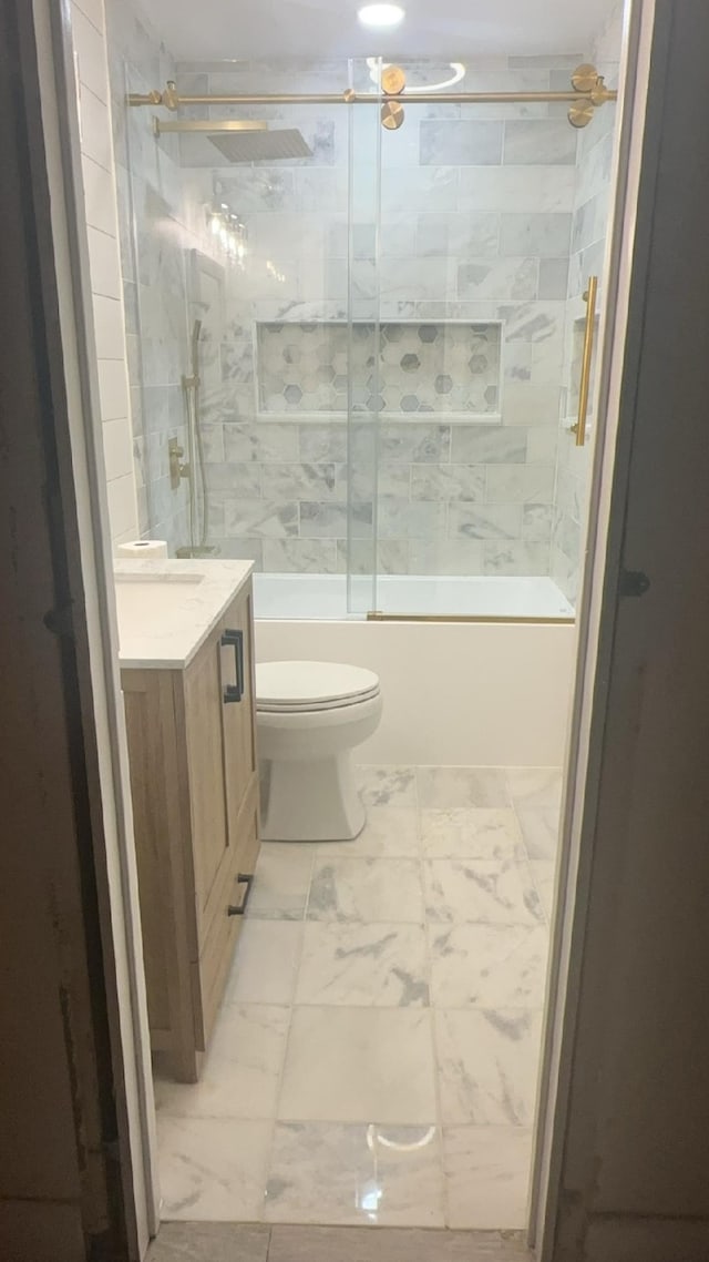 1113 Vista Dr, Mesquite, TX 75149 - bathroom with marble look tile flooring, vanity, enclosed tub / shower combo, and toilet