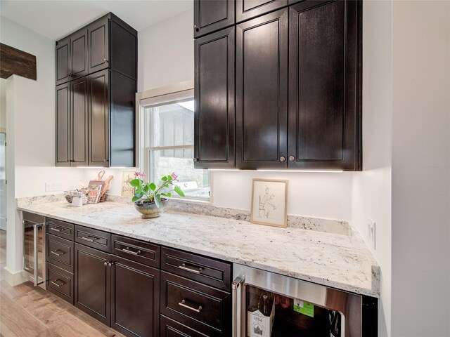 6362 Belz Rd, Sanger, TX 76266 - kitchen featuring light wood-style flooring, beverage cooler, and light stone counters