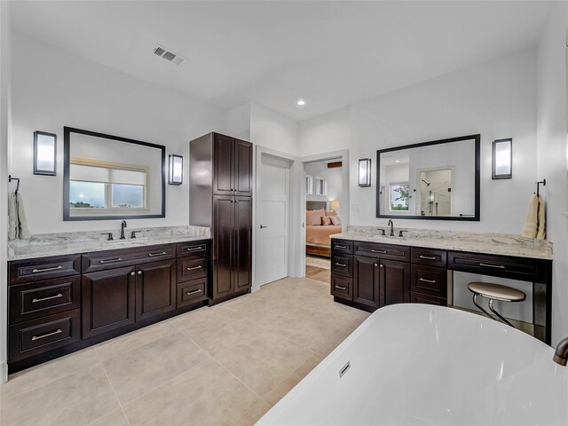 6362 Belz Rd, Sanger, TX 76266 - ensuite bathroom with tile patterned flooring, a soaking tub, a shower, and two vanities