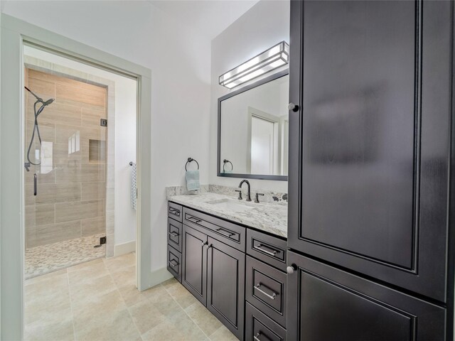 6362 Belz Rd, Sanger, TX 76266 - bathroom featuring a shower stall, vanity, tile patterned flooring, and baseboards