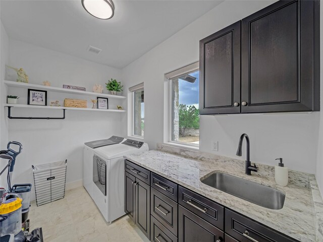 6362 Belz Rd, Sanger, TX 76266 - laundry area with separate washer and dryer, cabinet space, and light marble finish flooring