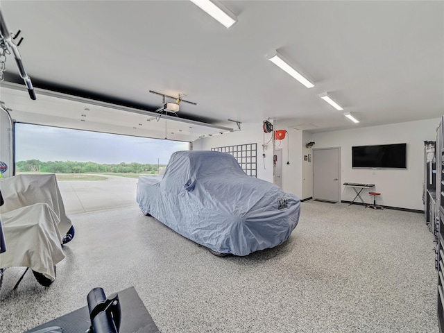 6362 Belz Rd, Sanger, TX 76266 - garage featuring a garage door opener