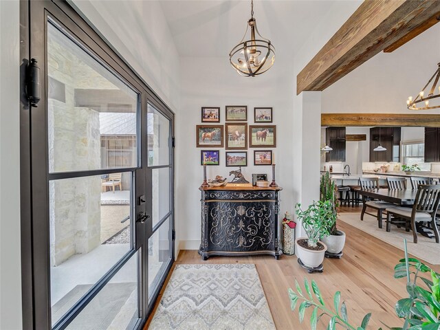 6362 Belz Rd, Sanger, TX 76266 - foyer featuring a chandelier, light wood-type flooring, and vaulted ceiling