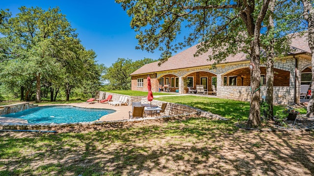 1851 Rock Church Hwy, Tolar, TX 76476 - swimming pool featuring a patio area and a lawn