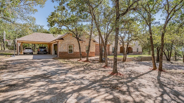 1851 Rock Church Hwy, Tolar, TX 76476 - view of front of house with dirt driveway, a carport, and stone siding