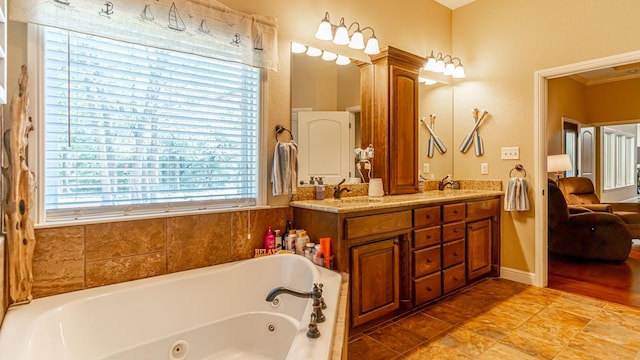 1851 Rock Church Hwy, Tolar, TX 76476 - bathroom featuring a whirlpool tub, decorative columns, double vanity, and crown molding