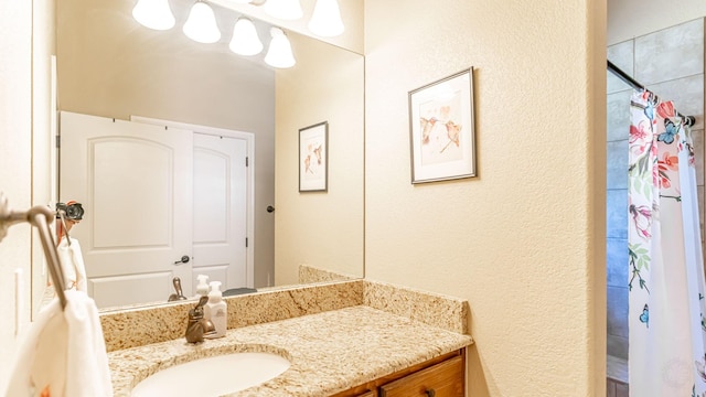 1851 Rock Church Hwy, Tolar, TX 76476 - full bathroom with a textured wall, vanity, and curtained shower