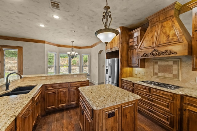 608 Guadalupe Rd, Keller, TX 76248 - kitchen featuring stainless steel appliances, a sink, dark wood finished floors, backsplash, and light stone counters