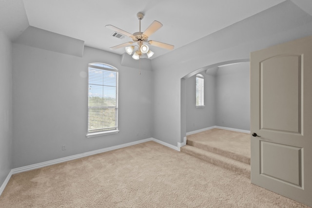608 Guadalupe Rd, Keller, TX 76248 - spare room featuring light carpet, arched walkways, healthy amount of natural light, and baseboards