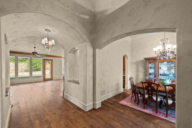608 Guadalupe Rd, Keller, TX 76248 - dining space with a chandelier, arched walkways, a ceiling fan, wood finished floors, and vaulted ceiling