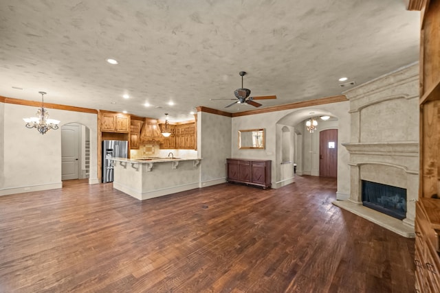 608 Guadalupe Rd, Keller, TX 76248 - unfurnished living room with arched walkways, a chandelier, ceiling fan, crown molding, and baseboards