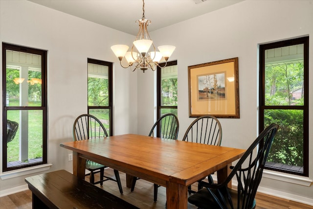 7016 Fm 3054, Malakoff, TX 75148 - dining area with a chandelier, baseboards, and wood finished floors