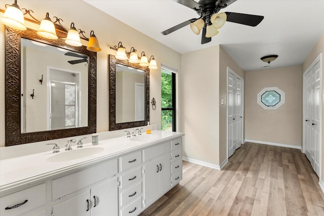 7016 Fm 3054, Malakoff, TX 75148 - full bath featuring ceiling fan, wood finished floors, an enclosed shower, and double vanity