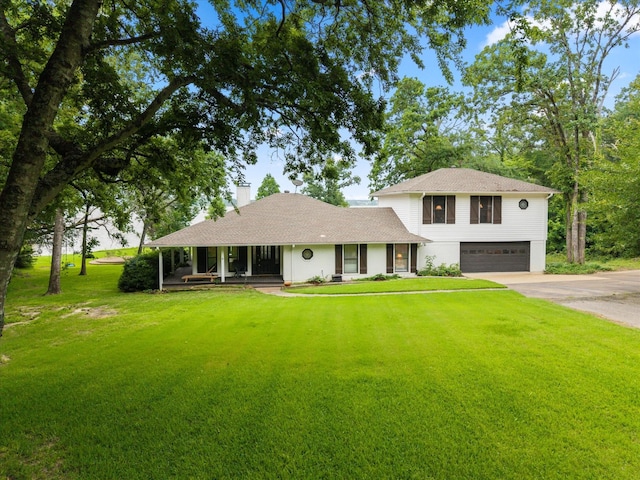 7016 Fm 3054, Malakoff, TX 75148 - view of front of home with an attached garage, a porch, a front lawn, driveway, and a chimney
