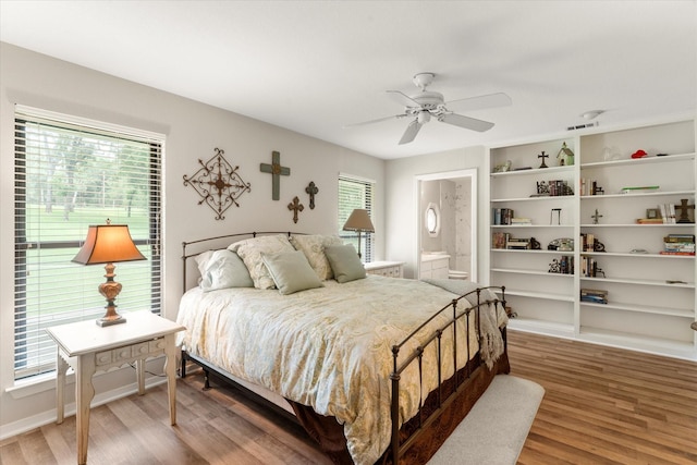 7016 Fm 3054, Malakoff, TX 75148 - bedroom featuring light wood-type flooring, ceiling fan, and ensuite bathroom