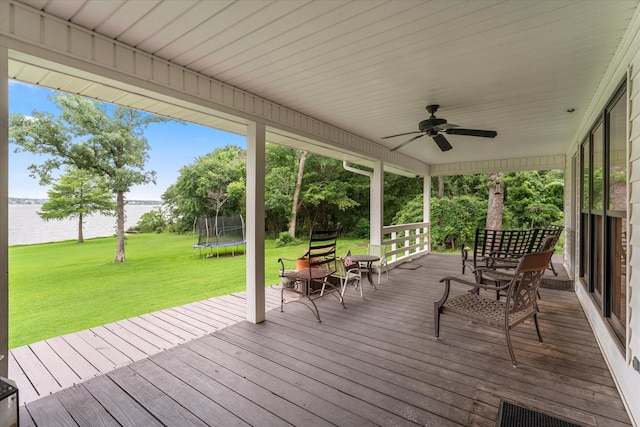 7016 Fm 3054, Malakoff, TX 75148 - wooden terrace featuring a water view, a trampoline, ceiling fan, and a lawn