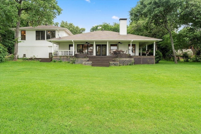 7016 Fm 3054, Malakoff, TX 75148 - back of property with a ceiling fan, a lawn, and a chimney