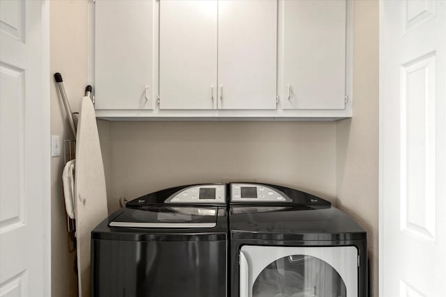 7016 Fm 3054, Malakoff, TX 75148 - laundry area featuring washing machine and dryer and cabinet space