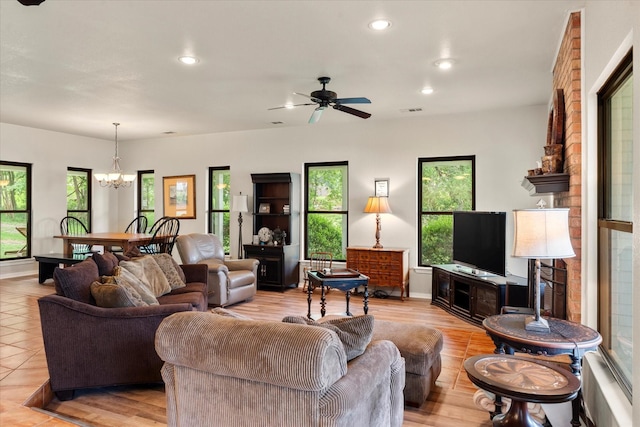 7016 Fm 3054, Malakoff, TX 75148 - living area with healthy amount of natural light, a chandelier, recessed lighting, a ceiling fan, and baseboards