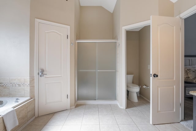 40 Pebble Beach St, Abilene, TX 79606 - bathroom with tile patterned floors, a shower stall, toilet, tiled tub, and lofted ceiling