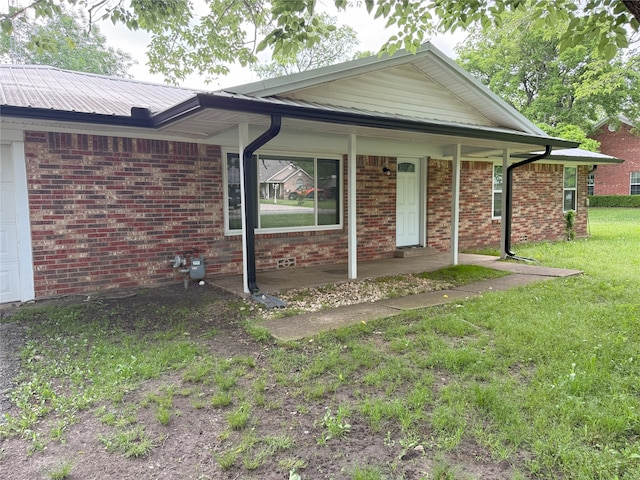 494 Lannius Rd, Dodd City, TX 75438 - ranch-style house with a front lawn, brick siding, and covered porch