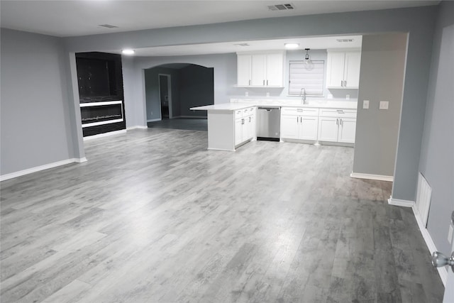 494 Lannius Rd, Dodd City, TX 75438 - kitchen featuring dishwasher, open floor plan, wood finished floors, white cabinetry, and light countertops