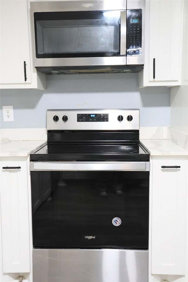 494 Lannius Rd, Dodd City, TX 75438 - kitchen with appliances with stainless steel finishes and white cabinetry