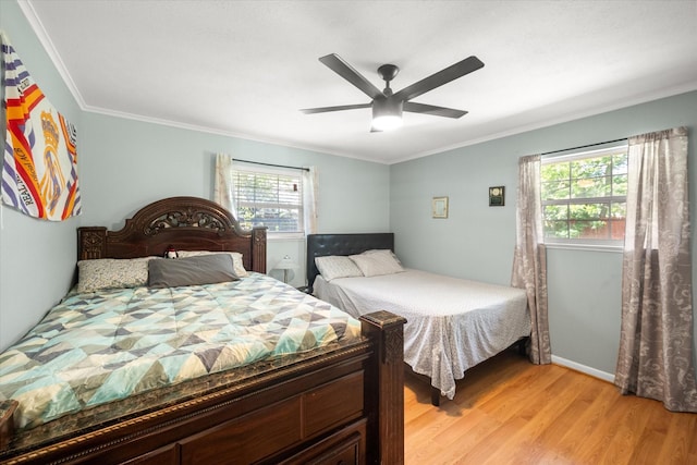 512 N 38th St, Corsicana, TX 75110 - bedroom featuring light wood-style floors, ornamental molding, ceiling fan, and baseboards
