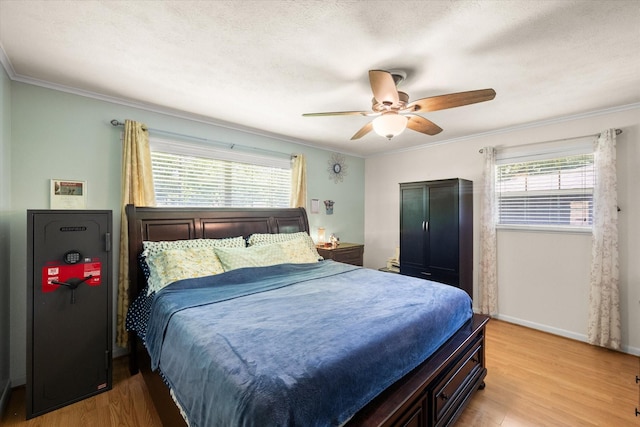 512 N 38th St, Corsicana, TX 75110 - bedroom featuring ornamental molding, wood finished floors, baseboards, and a ceiling fan