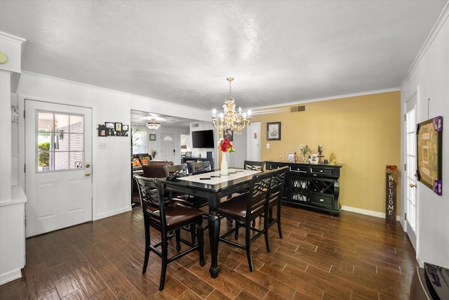 512 N 38th St, Corsicana, TX 75110 - dining area featuring a chandelier, dark wood-style floors, ornamental molding, and baseboards