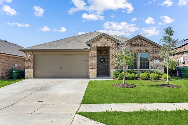 2118 Brisbon St, Fate, TX 75189 - view of front facade featuring brick siding, a front yard, a garage, driveway, and stone siding