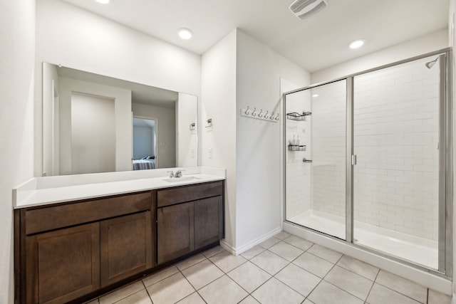2118 Brisbon St, Fate, TX 75189 - bathroom featuring a shower stall, tile patterned flooring, ensuite bath, vanity, and baseboards