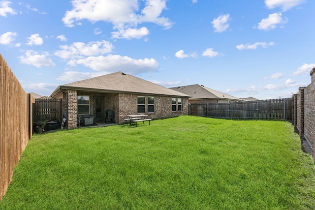 2118 Brisbon St, Fate, TX 75189 - back of property featuring brick siding and roof with shingles