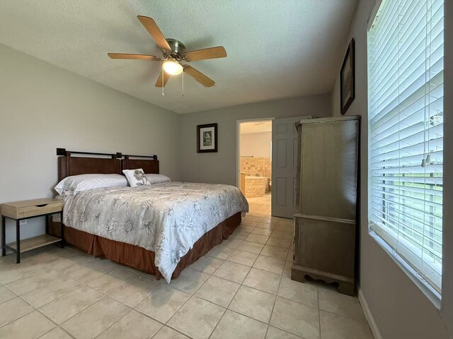 112 Plainview Dr, Wylie, TX 75098 - bedroom with light tile patterned floors, a textured ceiling, a ceiling fan, and ensuite bathroom