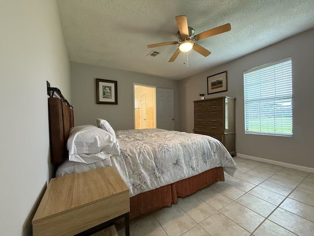 112 Plainview Dr, Wylie, TX 75098 - bedroom featuring a textured ceiling, light tile patterned floors, baseboards, and ceiling fan