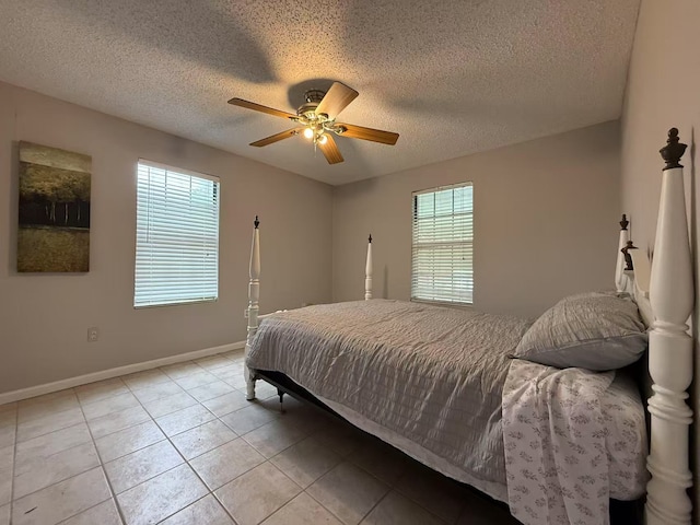 112 Plainview Dr, Wylie, TX 75098 - bedroom with a textured ceiling, baseboards, light tile patterned floors, and a ceiling fan