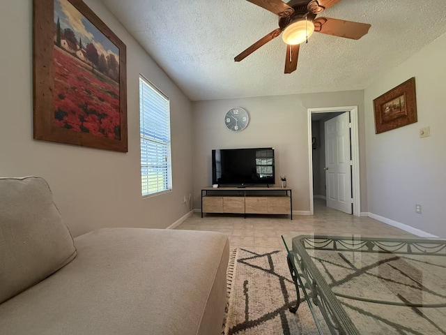 112 Plainview Dr, Wylie, TX 75098 - living area with a ceiling fan, a textured ceiling, and baseboards