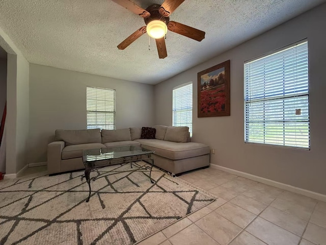 112 Plainview Dr, Wylie, TX 75098 - living area featuring a textured ceiling, healthy amount of natural light, baseboards, and ceiling fan