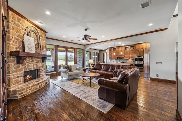 2035 Hodges Lake Dr, Rockwall, TX 75032 - living room featuring ornamental molding, baseboards, dark wood-style floors, a fireplace, and recessed lighting
