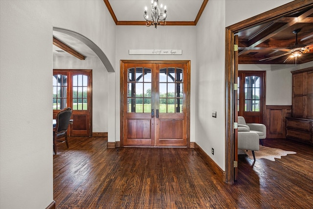 2035 Hodges Lake Dr, Rockwall, TX 75032 - foyer entrance featuring dark wood finished floors, french doors, beamed ceiling, arched walkways, and ornamental molding
