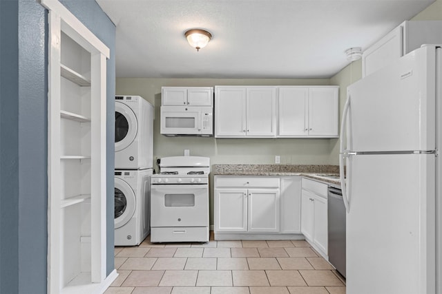 3508 Valencia Ct, Fort Worth, TX 76116 - kitchen featuring white appliances, stacked washer / drying machine, white cabinetry, and light tile patterned floors