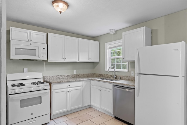3508 Valencia Ct, Fort Worth, TX 76116 - kitchen with white appliances, a sink, white cabinetry, and light tile patterned flooring