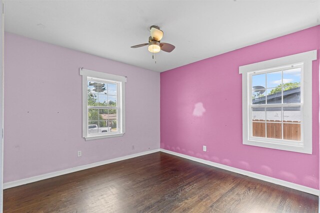 3508 Valencia Ct, Fort Worth, TX 76116 - empty room with healthy amount of natural light, wood finished floors, a ceiling fan, and baseboards