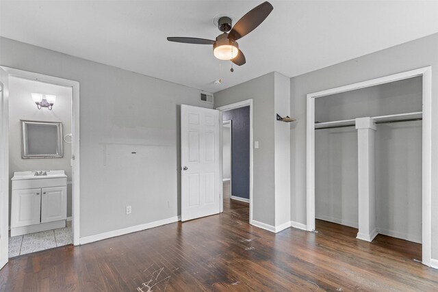3508 Valencia Ct, Fort Worth, TX 76116 - unfurnished bedroom featuring wood finished floors, baseboards, connected bathroom, a closet, and a sink