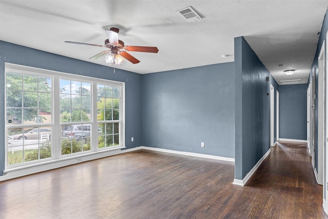 3508 Valencia Ct, Fort Worth, TX 76116 - unfurnished room with a ceiling fan, wood finished floors, baseboards, and a textured ceiling